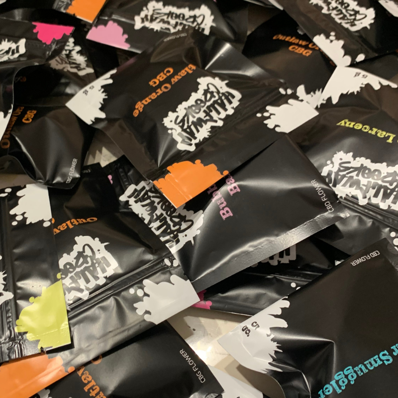 Halfway Crooks, cbd, cbg, flowers, hemp, sample, pouches on table.